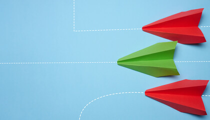 Three paper airplanes are moving forward, one turned sideways, representing the concept of...