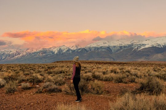 Woman in Mountains at Sunset