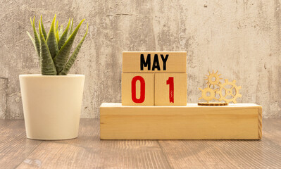 May 1st. Image of may 1 wooden color calendar on white background. - obrazy, fototapety, plakaty