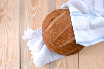 loaf of bread on wooden table