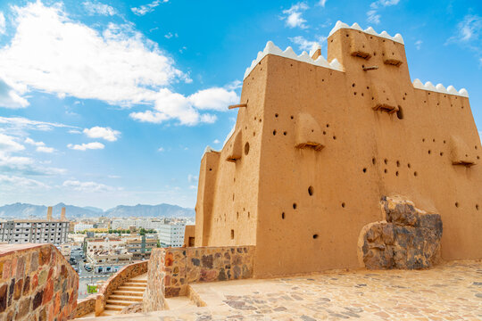 Hail city downtown and walls of Arabian Aarif fortress standing on the hill, Hail, Saudi Arabia