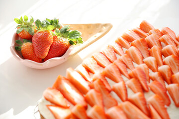 Strawberry pie homemade next to clay ice cream cone shaped bowl background light fresh berries red berries copy space background