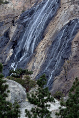 Fototapeta na wymiar Eastern Sierra Waterfall with trees (during long drought)