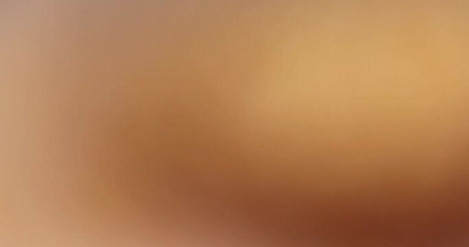 slowly changing abstract orange background, abstract background from unfocused video shooting of orange objects