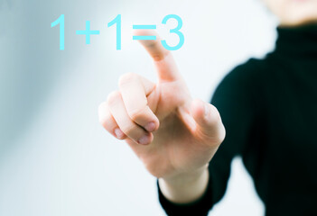 Obraz premium Woman using futuristic digital interface display 1+1=3 Business, technology, internet concept.
