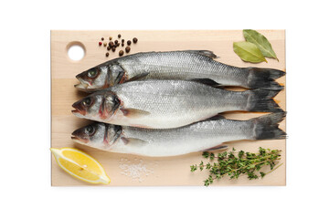 Board with fresh sea bass fish and ingredients on white background, top view