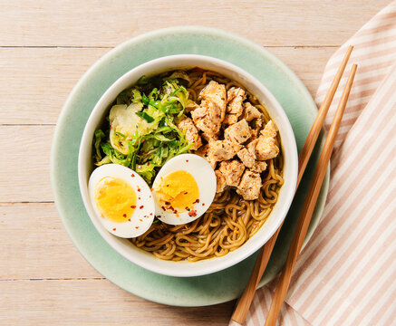 Bowl of ramen noodle soup with tofu and brusell sprouts  and egg