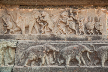 Medieval stone wall carvings of animals from ancient architecture ruins at the royal enclosure at Hampi, Karnataka India