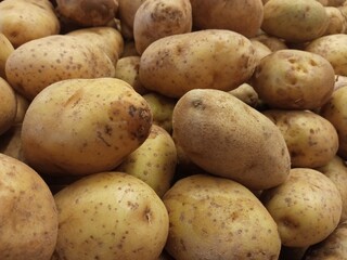 Potatoes on the counter of a vegetable store, close-up