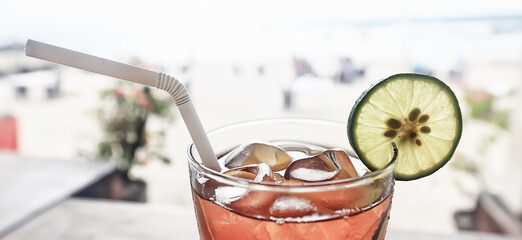 iced tea with ice and lemon at the beach bar