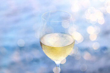 a glass of white wine in a restaurant, alcohol luxury background