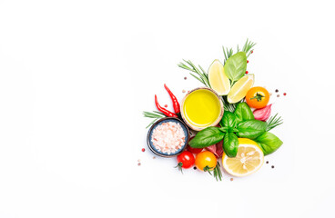 Fresh summer spicy herbs and spices for mediterranean diet. Tomato, green basil, chilli, garlic and other. Vegan healthy food on white background. Cooking concept, top view, copy space