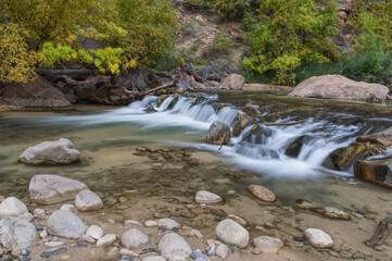stream flowing over rocks long exposure soft waterfall
