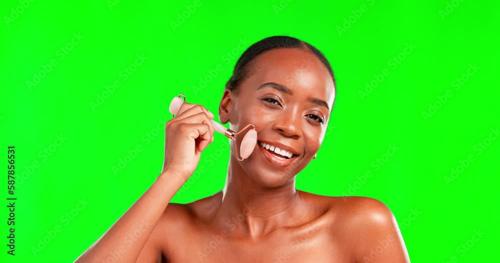 Canvas Prints Black woman, beauty and facial roller on a green screen for skincare, cosmetics and dermatology. Face portrait of aesthetic female model in studio for massage, self care and skin glow with a smile