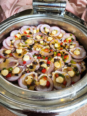 scallops in steam pot on the table

