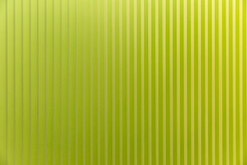 Obraz premium Lathed wall panel of bright light green color. Modern trends in interior design. Space for text. Front view.