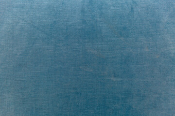 Surface and texture of a blue fabric panel. Modern trends in interior design and decor. Space for text.