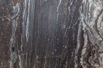 Dark marble surface with natural pattern. Decor and interior design, construction and repair. Space for text.