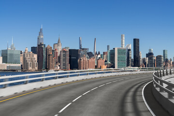 Obraz premium Empty urban asphalt road exterior with city buildings background. New modern highway concrete construction. Concept of way to success. Transportation logistic industry fast delivery. New York. USA.