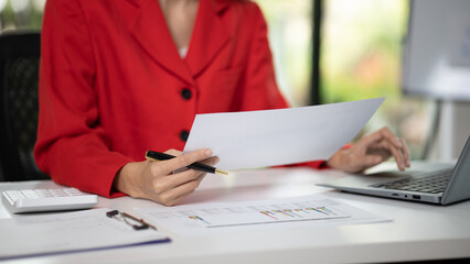 Company finance staff preparing financial documents, company finance staff preparing company...