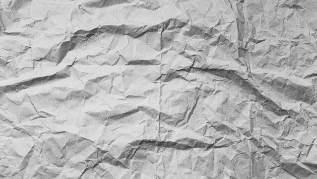 Stop motion photography animation concept. Close-up of crumpled paper of black and white. Textured abstract background with copy space.
