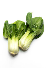 Isolated Fresh Organic Pak Choi, Bok Choy, a Chinese Cabbage, Raw Natural Healthy Vegetable Lying On White Background, Flat Lay, Top View. Asian Cuisine. Vertical plane. High quality photo.