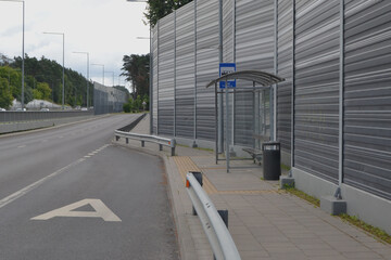 Bus stop near the sound-absorbing tunnel. Modern technology in the city. Vilnius, Lithuania.