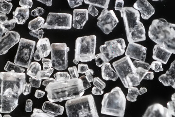sugar crystals black background microscope