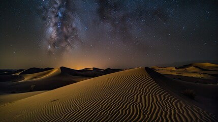 Fototapeta na wymiar Abstract time lapse night sky with shooting stars over desert dune landscape. Milky way glowing lights background. 