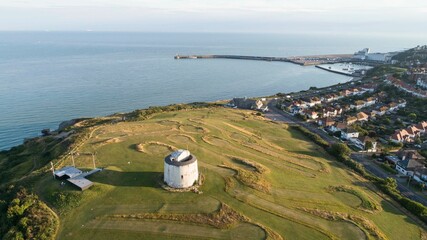 Folkestone's Martello Tower and Harbour Arm from the air.