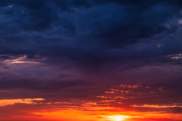 Fototapeta na wymiar Beautiful contrast of storm clouds and setting sun
