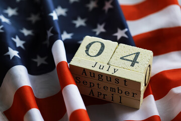 July 4th wooden Stars and Stripes flag on background with flag of the USA. Summer day. Independence...