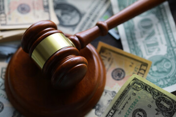 judge gavel and money on brown wooden table concept - obrazy, fototapety, plakaty