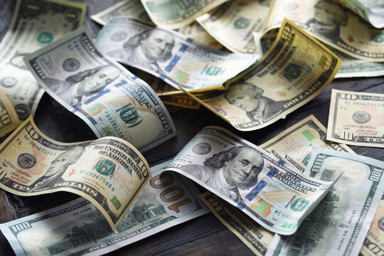 Money, US dollar bills background. Money scattered on the desk. Photography for Finance and Economy concepts.