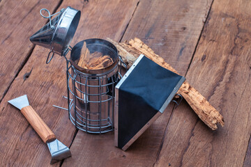 Beekeeping Tools on a Wooden Table close up
