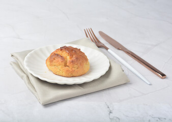 gourmet freshly bake golden Texas sweet original honey biscuit bun cake scone milk butter bread in square bento wood box on white marble table rose gold fork knife pastry halal dessert vegan menu