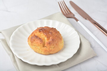 gourmet freshly bake golden Texas sweet original honey biscuit bun cake scone milk butter bread in square bento wood box on white marble table rose gold fork knife pastry halal dessert vegan menu