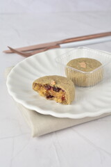 mini bake luxury tart in Japanese matcha hojicha green tea crisp with cranberry pineapple jam paste inside shining rose gold bronze iron box packaging on white marble pastry dessert halal party menu