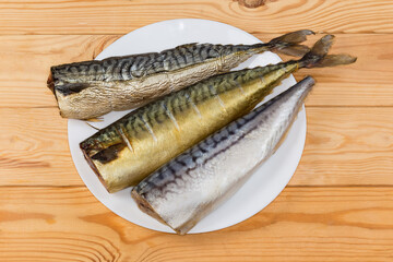 Hot-smoked, cold-smoked and salted mackerels on a dish