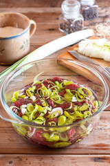 Meat medallions with leek. Pork medallions.