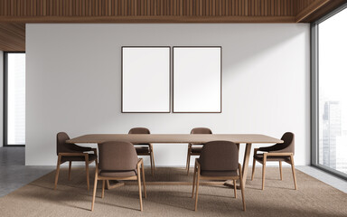 White and wooden dining room with posters