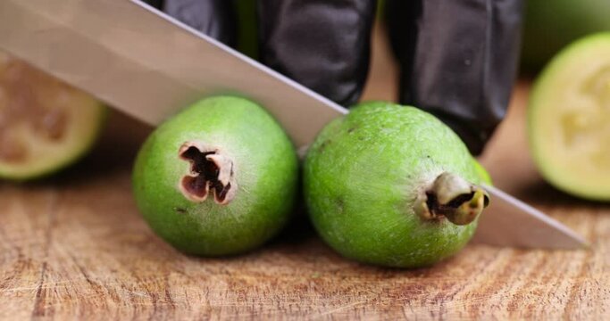 cut delicious sweet and sour green feijoa on the table, harvested a small amount of oriental feijoa fruit