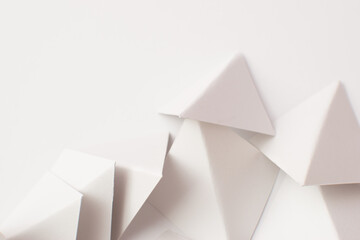 3d white triangle shapes on white background