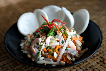 The salad made from lotus roots with pork and shrimp