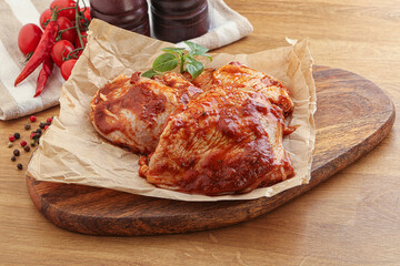 Marinated chicken leg in tomato sauce