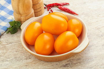 Sweet ripe yellow tomato in the bowl