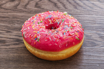 Sweet glazed struwberry donut with icing
