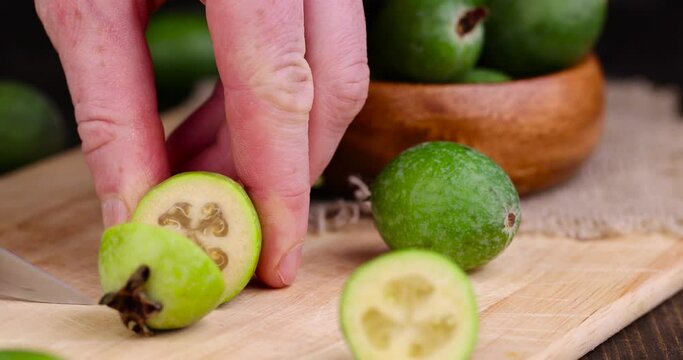 cut delicious sweet and sour green feijoa on the table, harvested a small amount of oriental feijoa fruit