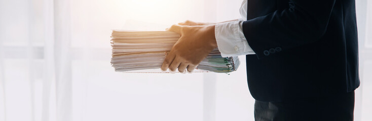 Financial analysts analyze business financial reports on a digital tablet planning investment project during a discussion at a meeting of corporate showing the results of their successful teamwork.
