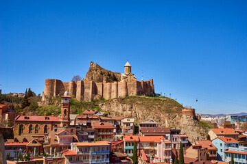 Panorama of Tbilisi with the Narikala fortress and Georgian old houses - obrazy, fototapety, plakaty